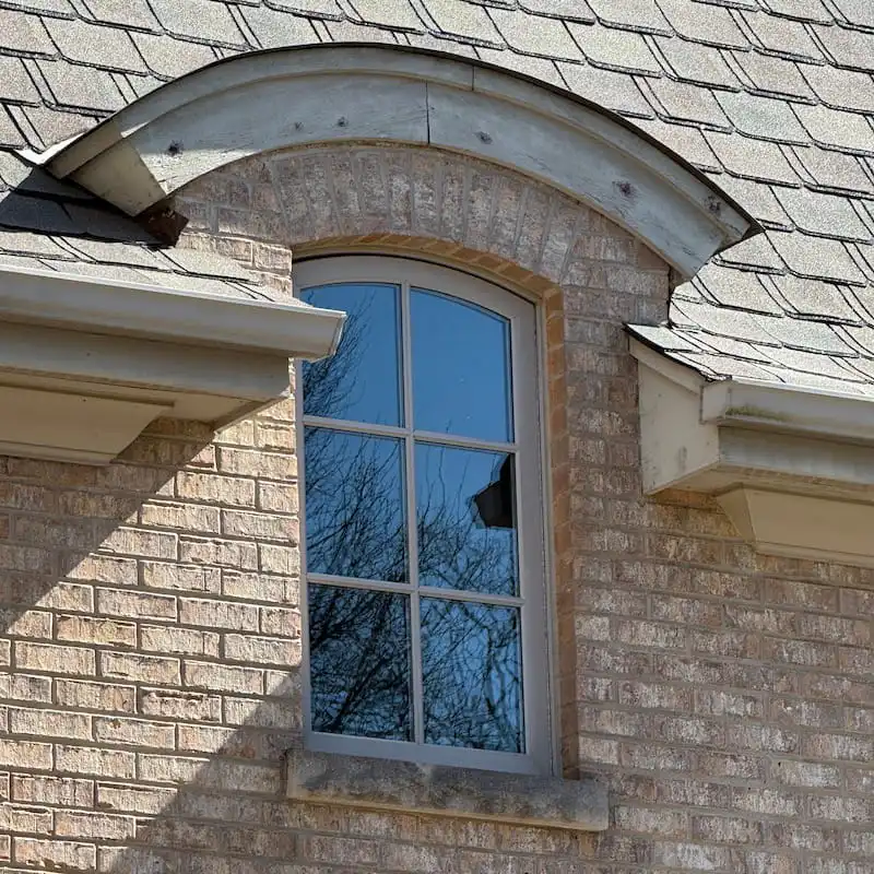 Arched window on brick house exterior in Arlington Heights, IL